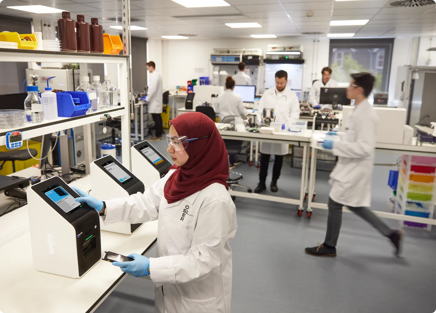 A scientist using the Osler Origin analyser in a lab